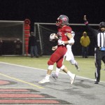 Evan Pappas/Staff Photo                                Bonda jumps into the end zone during the Homecoming game on Friday, Oct. 21 for his second touchdown of the night.