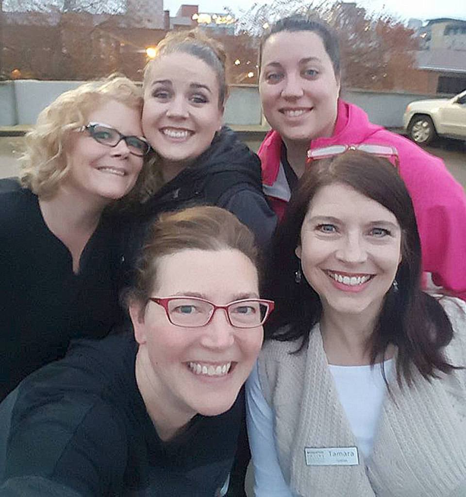 Courtesy Photo                                Leslie Beck, Amye Godsey, Sarah Field, Dr. Rebecca Dale and Tamara Nassar, all staff at Snoqualmie Valley Eyecare, pose for a team photo outside the Seattle King County Clinic, held last weekend at the Key Arena in Seattle.