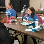 Tamara Nassar helps check patients in at the Seattle King County Clinic.                                Courtesy Photo