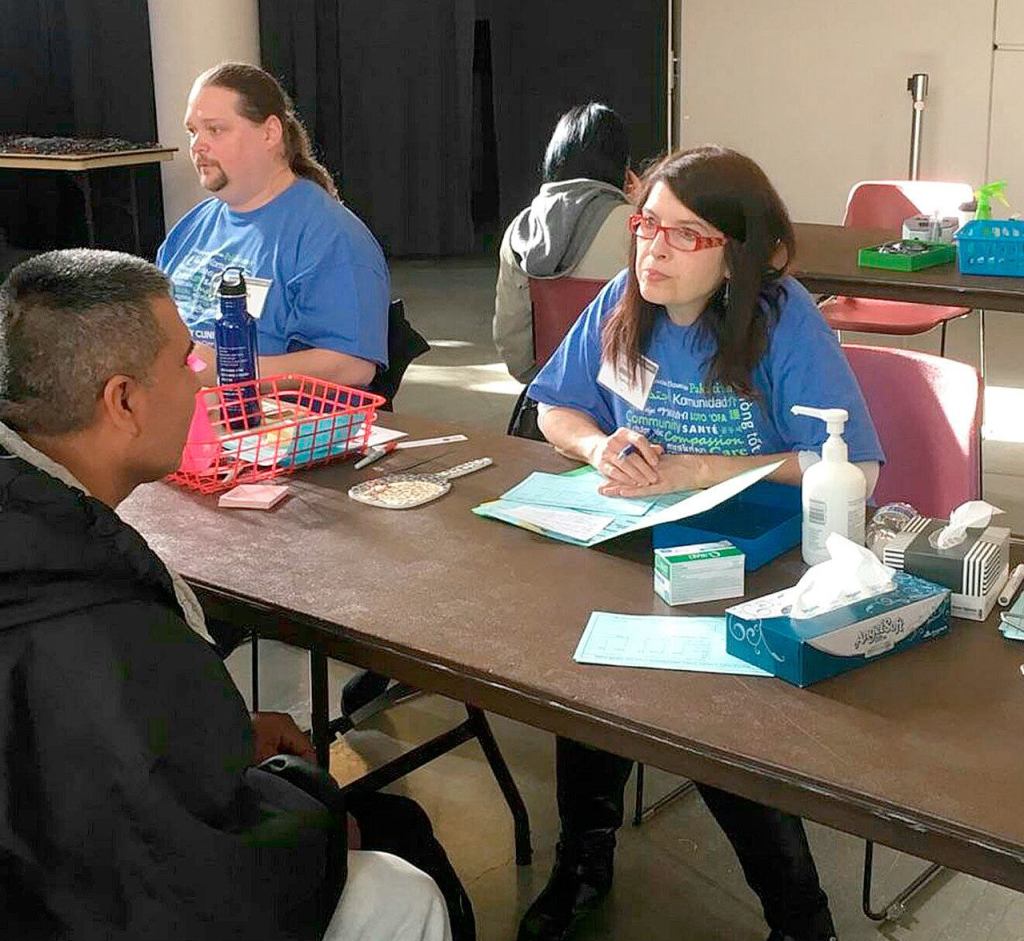 Tamara Nassar helps check patients in at the Seattle King County Clinic.                                Courtesy Photo