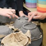 Students work on the finishing touches of their creations for the 2017 Empty Bowls event. Evan Pappas/Staff Photo
