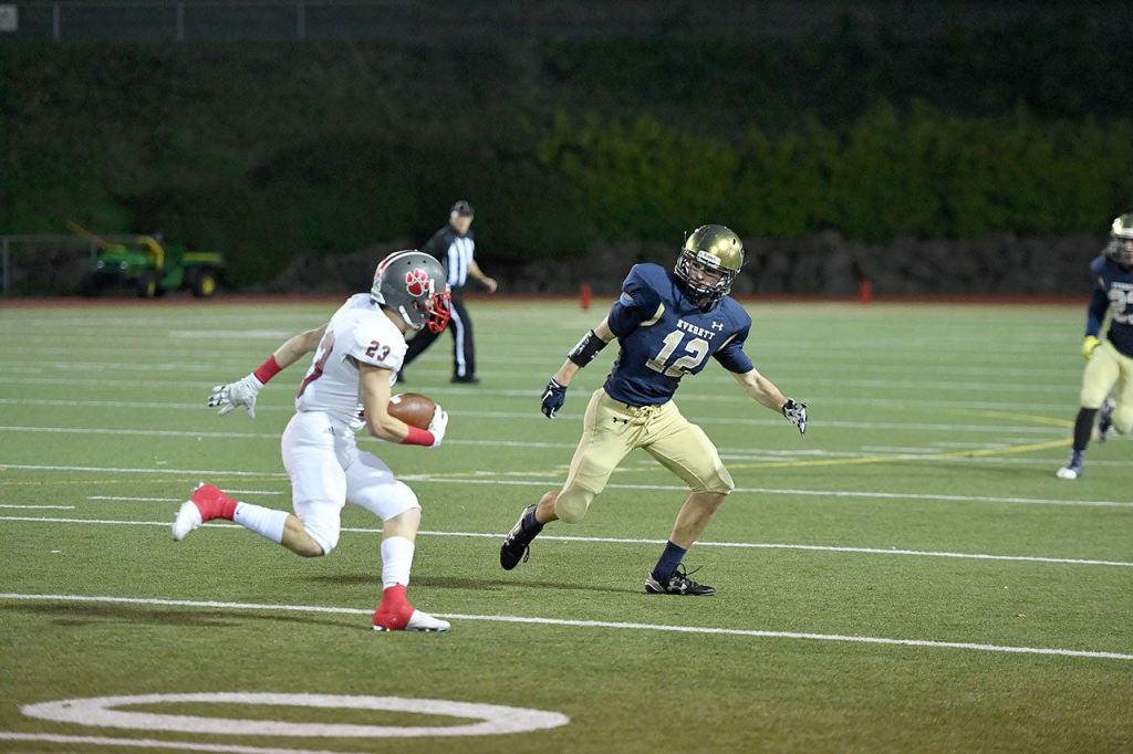 Garrett Stiller faces off against an Everett player in the second half. (Courtesy of Calder Productions)