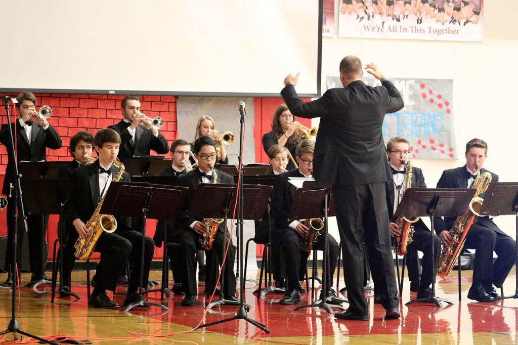Mount Si High School&rsquo;s band teacher Matt Wenman spoke about his time in the National Guard before leading the jazz band in a performance of &ldquo;America the Beautiful.&rdquo; (Evan Pappas/Staff Photo)