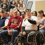 At the high school assembly, Mike Hodge talks about his service in Vietnam and said he was honorably medically retired after losing his legs in 1968. (Evan Pappas/Staff Photo)