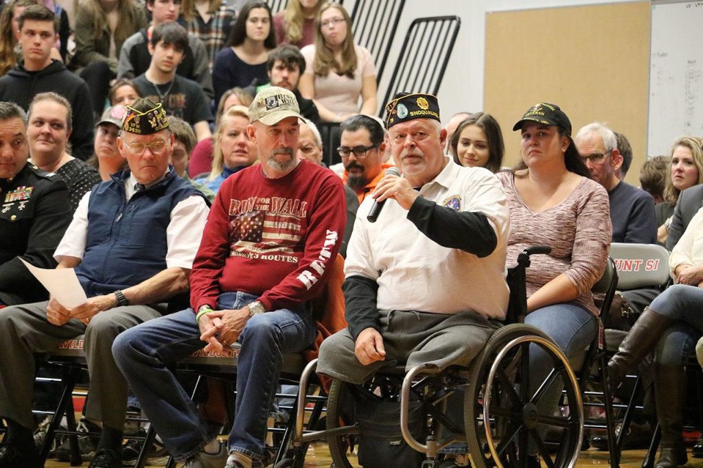 At the high school assembly, Mike Hodge talks about his service in Vietnam and said he was honorably medically retired after losing his legs in 1968. (Evan Pappas/Staff Photo)