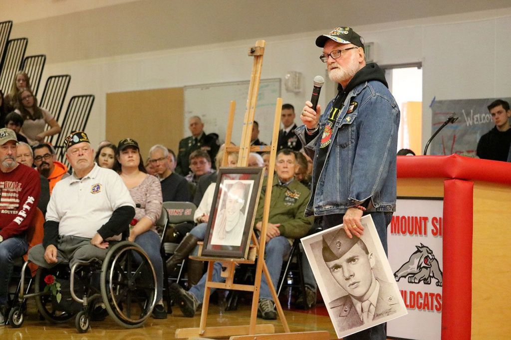 Michael Reagan shared the story of how the Fallen Heroes Project began and how donations from the Snoqualmie Valley School District help fund the project. (Evan Pappas/Staff Photo)