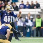 Cameron Van Winkle kicks an extra point, while Jeff Lindquist holds, against Arizona State Saturday. After the night was over, Van Winkle set a Husky record for the most PAT&rsquo;s in a season.                                James Gibowski Photo