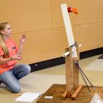 Sixth grader Sydney Dunn tests her catapult in the Twin Falls Middle School commons last Wednesday.                                Carol Ladwig/Staff Photo