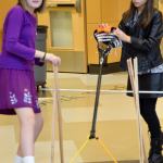 Audrey Hofmann and Evan Symington get ready to launch a beanbag in a hang-time test of their lacrosse-inspired catapult.                                Carol Ladwig/Staff Photo
