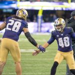 After he kicks a field goal against Arizona State on Saturday, Cameron Van Winkle (right) is congratulated by teammate and friend Psalm Wooching. The two, who were introduced together as seniors at the start of Saturday&rsquo;s game, have shared a lot of big moments in their senior year, including Van Winkle&rsquo;s assist when Wooching asked his girlfriend, former UW softball player Courtney Gano, to marry him, via the Husky Stadium scoreboard.                                 James Gibowski Photo