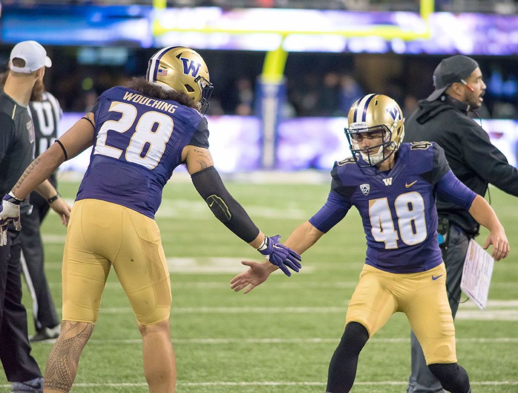After he kicks a field goal against Arizona State on Saturday, Cameron Van Winkle (right) is congratulated by teammate and friend Psalm Wooching. The two, who were introduced together as seniors at the start of Saturday&rsquo;s game, have shared a lot of big moments in their senior year, including Van Winkle&rsquo;s assist when Wooching asked his girlfriend, former UW softball player Courtney Gano, to marry him, via the Husky Stadium scoreboard.                                 James Gibowski Photo