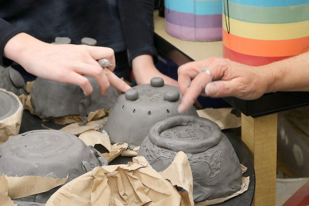 Students work on the finishing touches of their creations for the 2017 Empty Bowls event.Students work on the finishing touches of their creations for the 2017 Empty Bowls event.
