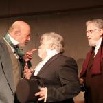 Scrooge, played by Gary Schwartz, angrily tells the two solicitors, played by Craig Ewing and Robert J. Lee, to get out of his office. (Evan Pappas/Staff Photo)