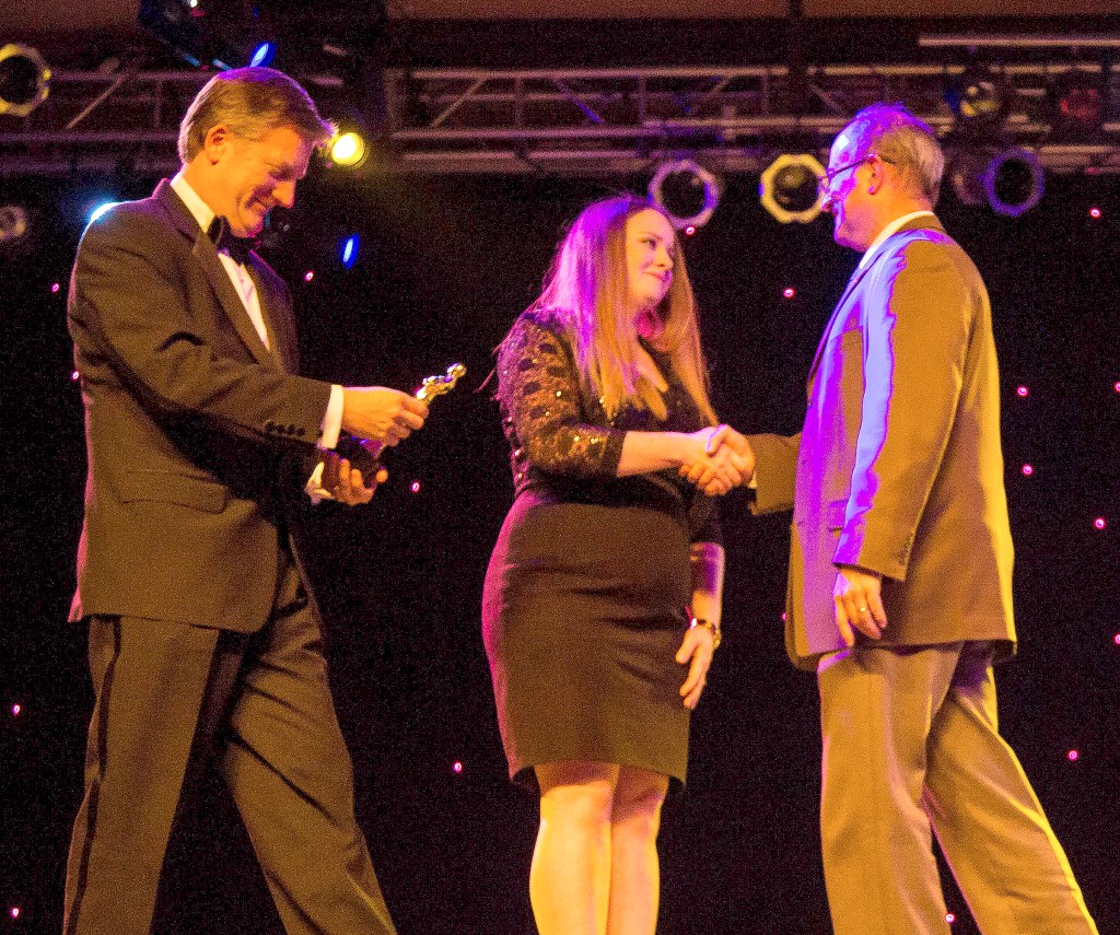 Courtesy Photo                                Rob Wotton presents the Business of the Year award to Snoqualmie Ridge IGA representatives.
