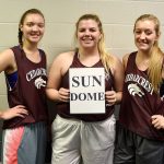 Carol Ladwig/Staff Photos                                 Team captains for the second year running for the Cedarcrest girls basketball team are, from left, Kennedy Howell, Meredith Burke holding the team&rsquo;s Sun Dome sign, and Mieke VanEss.