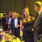 Courtesy Photo                                Guests survey the many prizes available to the highest bidder in the Chamber of Commerce Nov. 18 gala.