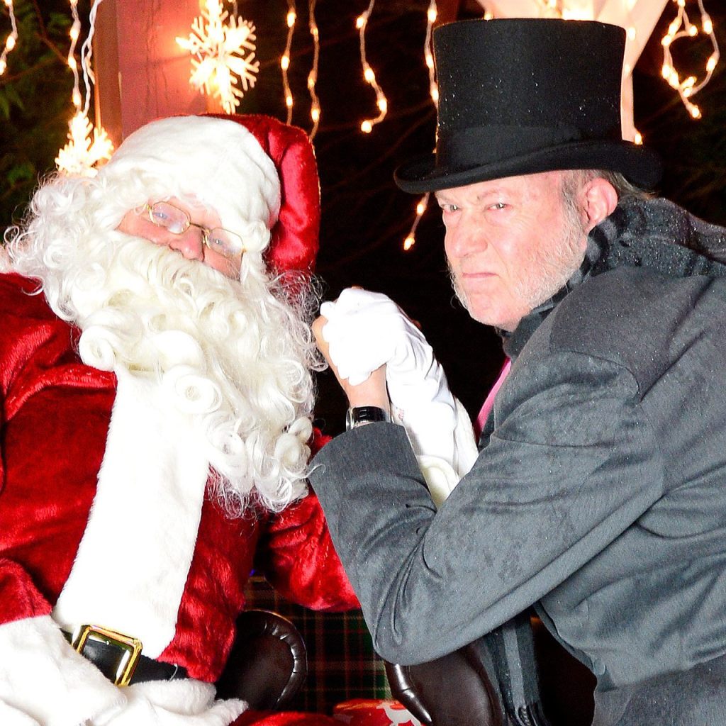 Santa and Ebenezer Scrooge, played by Gary Schwartz in the Valley Center Stage production of &ldquo;A Christmas Carol&rdquo; running through Dec. 17, mug for the camera. Mary Miller Photo
