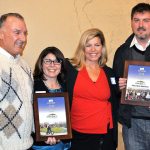 North Bend representatives accepted the Community Partner of the Year award from Encompass at the organization&rsquo;s board meeting Dec. 5. Pictured from left are North Bend Councilman, and chairperson of the Transportation and Public Works Committe, Ross Loudenback, Encompass Executive Director Nela Cumming, North Bend City Administrator Londi Lindell, and North Bend Public Works Director Mark Rigos.                                Courtesy Photo