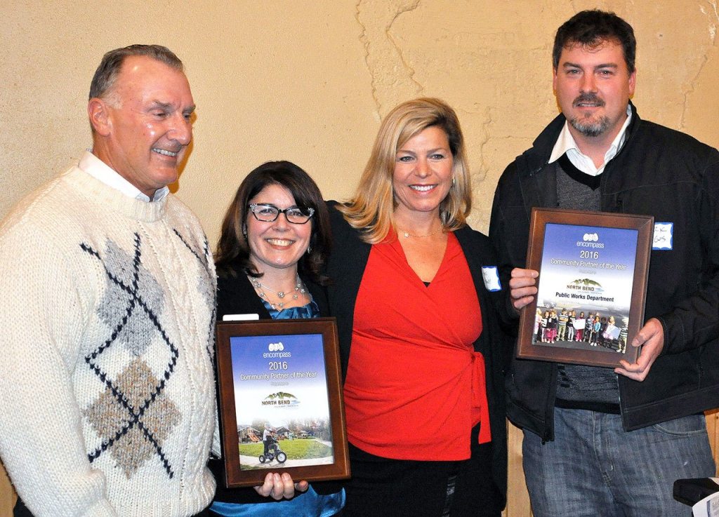 North Bend representatives accepted the Community Partner of the Year award from Encompass at the organization&rsquo;s board meeting Dec. 5. Pictured from left are North Bend Councilman, and chairperson of the Transportation and Public Works Committe, Ross Loudenback, Encompass Executive Director Nela Cumming, North Bend City Administrator Londi Lindell, and North Bend Public Works Director Mark Rigos.                                Courtesy Photo