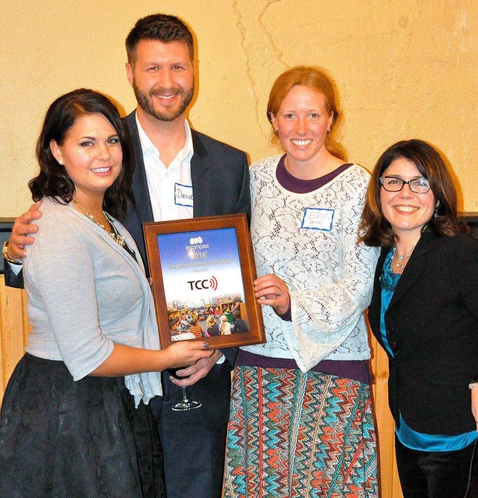 Tara DesJardin and Darrell Niemiec of TCC accept the Encompass Corporate Partner of the Year Award from Erin Davies and Nela Cumming of Encompass.                                Courtesy Photo