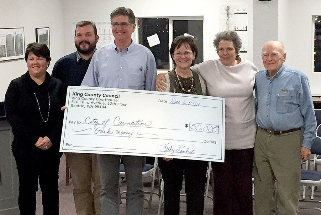 King County Councilwoman Kathy Lambert, representing District 3, presented a check to the Carnation City Council Dec. 6, for parks. Pictured from left, are Carnation City Councilors Kim Lisk and Dustin Green, Mayor Jim Berger, Councilwoman Kathy Lambert, and Councilors Lee Grumman and Fred Bereswill.                                Courtesy Photo