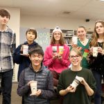 The eight Mount Si High School students who designed the custom coffee sleeves. From left, back row: Dawson Bolen, Natalie Ng, Brandon Roberts, Delany Edwards, Lillian Nordbey. Front row: Jasper Chee and Emily Creed. (Evan Pappas/Staff Photo)