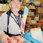 Art Hobbs helps out at the Snoqualmie Valley Food Bank in 2012.                                File Photo