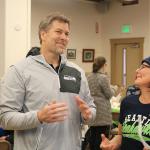 Robbie Tobeck talks to some of the fans and signs autographs at the holiday lunch. (Evan Pappas/Staff Photo)