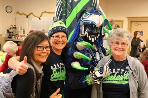 Seahawk, superfans, visit Carnation senior center during 12 Days of Goodness