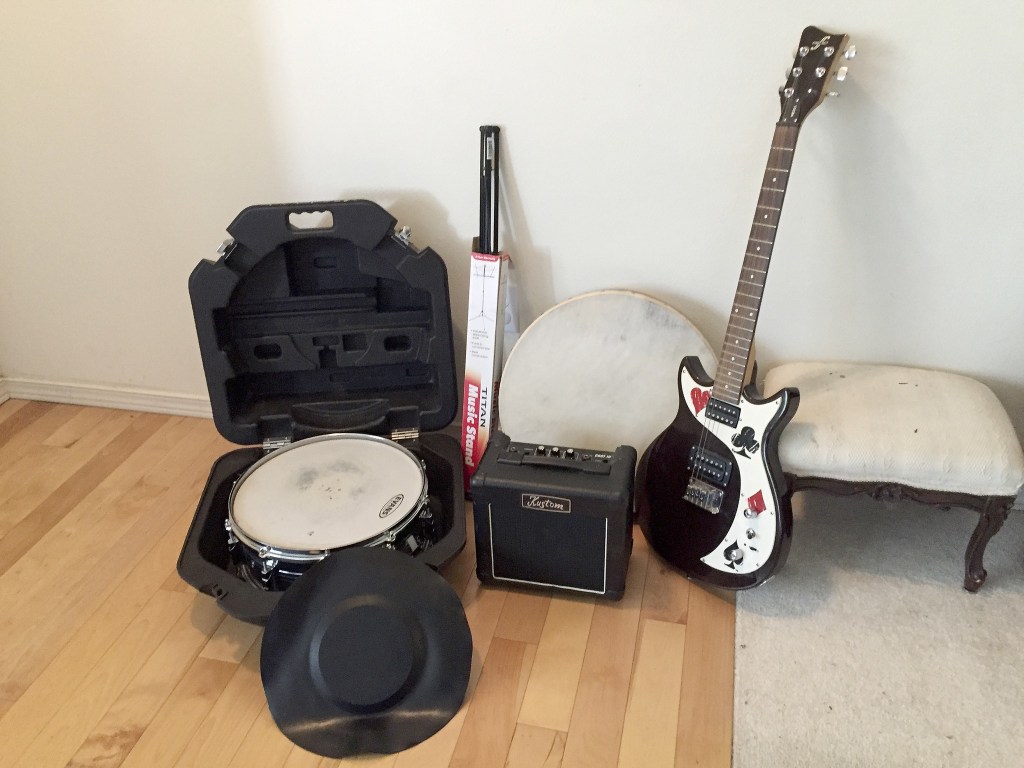 Some of the equipment Ostrem will be donating in January including a drum, music stand, amp, and electric guitar. (Courtesy Photo)