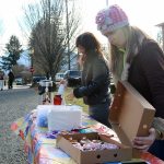 Kristen Zuray and Tonya Guinn set up a table of coffee and doughnuts for the Trail Youth project, which officially came to Snoqualmie Valley on Tuesday. The group aims to help connect teens and young adults who are struggling, with resources that can help them.                                Evan Pappas/Staff Photo