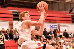 Freshman Jabe Mullins makes a big jump at the home game against Inglemoor on Jan. 6. (Courtesy of Calder Productions)
