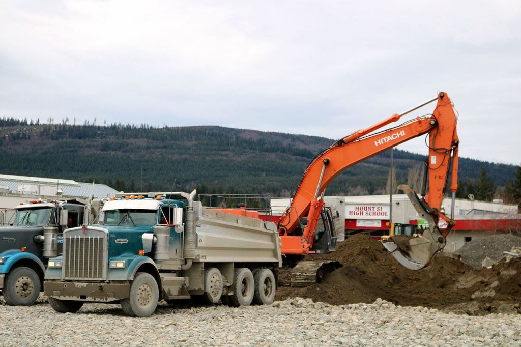 Construction is underway at Mount Si High School as trucks are loaded with dirt from what used to be the school&rsquo;s main parking lot.                                Evan Pappas/Staff Photo