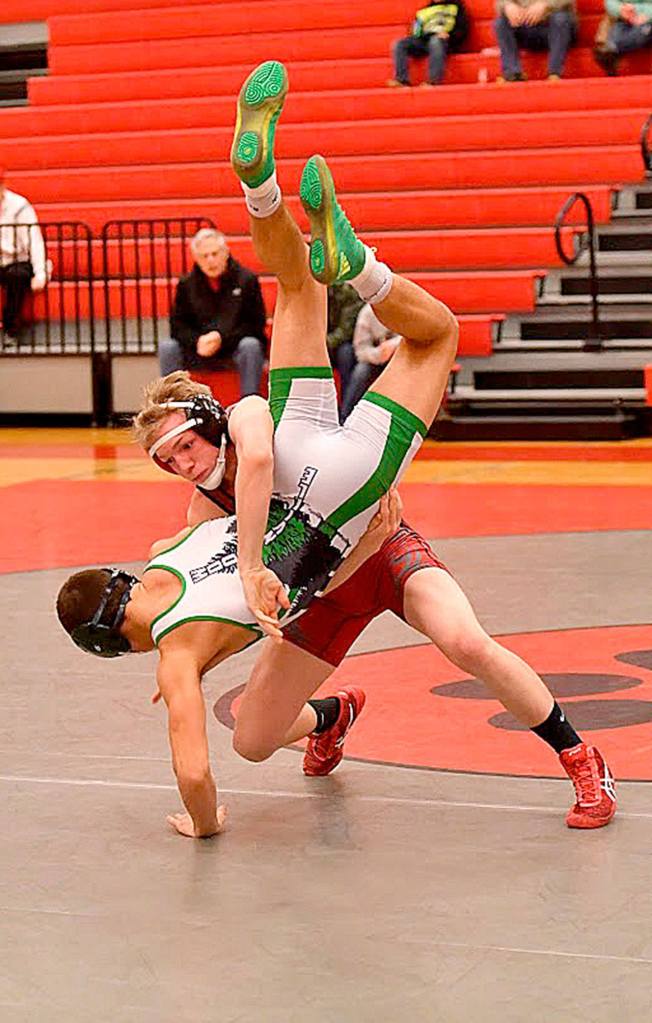 Photo courtesy of Calder Productions                                Duncan Harrison lifts his opponent Nolan Downs, of Woodinville, at the team&rsquo;s Jan. 19 meet, at home. Harrison won the match by a pin.