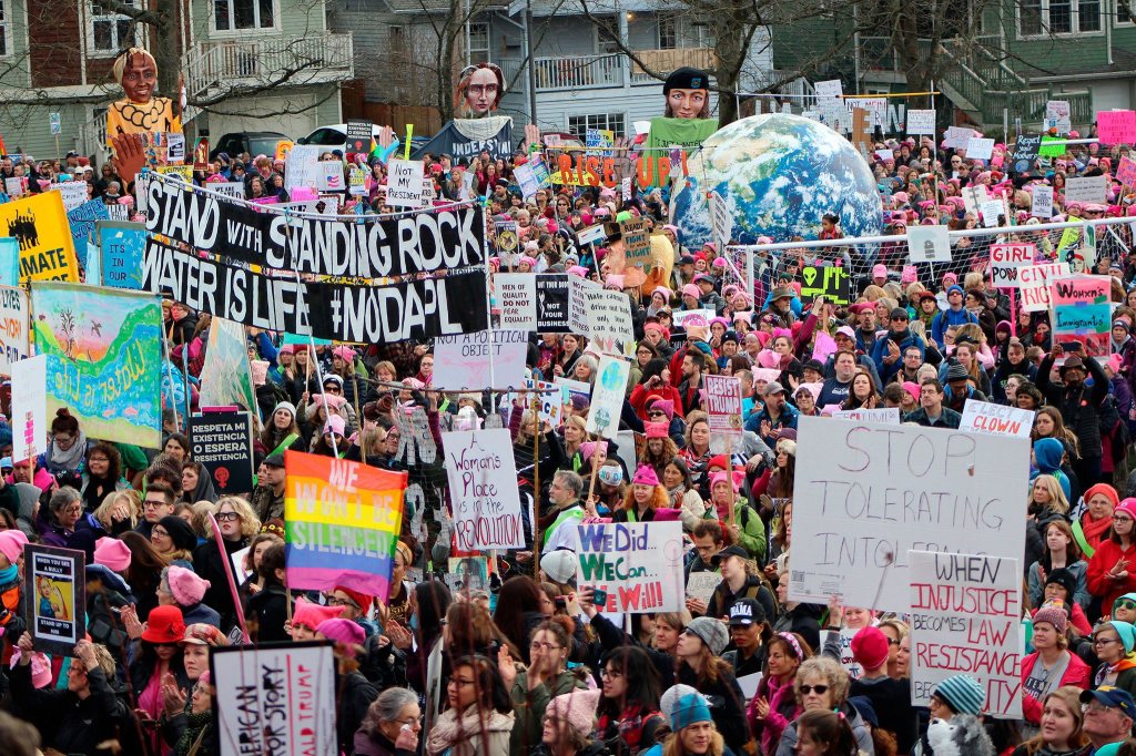 Marchers gather in Judkins Park to listen to speeches before marching to Seattle Center Saturday in the Women&rsquo;s March on Seattle.                                Allison DeAngelis/Staff Photo
