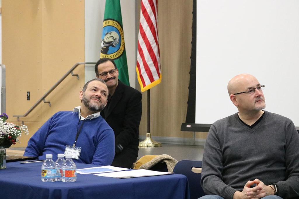 Alaa Badr, Usama Baioumy, and Monty Wright are thanked for their participation in the event by Snoqualmie Mayor Matt Larson. (Evan Pappas/Staff Photo)