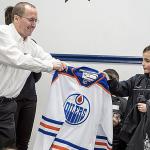 Zach receives an autographed Oilers jersey from Make-a-Wish.                                Courtesy Photo