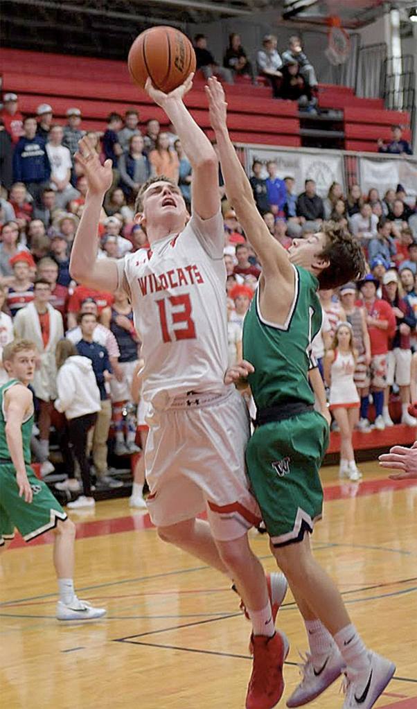 Photo courtesy of Calder Productions                                Senior Gavin Gorrell takes a foul as he goes up for a jump shot in Saturday&rsquo;s game against Woodinville.
