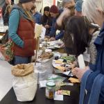 Talina Appling answers questions as seed gatherers fill their packets and jot down notes.                                Carol Ladwig/Staff Photo