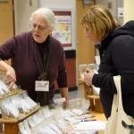 Darien Payne discusses various seeds with a participant in the seventh annual Snoqualmie Valley Seed Exchange.                                Carol Ladwig/Staff Photo