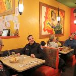 Snoqualmie Fire Chief Mark Correira serves some Enchilada&rsquo;s to other Snoqualmie firefighters who came by to support the YMCA. (Evan Pappas/Staff Photo)