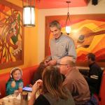 Snoqualmie Mayor Matt Larson chats with a family eating at Ana&rsquo;s during the YMCA&rsquo;s fundraiser last Tuesday. (Evan Pappas/Staff Photo)