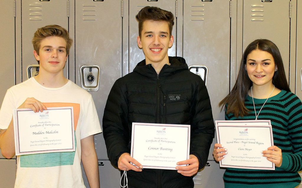 Courtesy Photos                                Clockwise from top, right, Maddox Malcolm&rsquo;s mountains photo took first place in the Region category of the recent SkillsUSA Puget Sound Region Photography competition; Connor Bunting&rsquo;s dramatic portrait earned a first-place award; Claire Meyer took second place in Gallery with this colorful image, she also took second place in Region; Mount Si student photographers from left are Maddox Malcolm, Connor Bunting and Claire Meyer; and Maddox Malcolm&rsquo;s motion capture of a hummingbird.