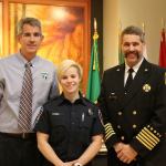 Theresa Tozier, Snoqualmie Fire Department&rsquo;s newest full-time firefighter, was presented her helmet and badge at the meeting. (Evan Pappas/Staff Photo)
