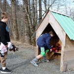 Evan Pappas/Staff Photo                                Gavin Wyrsch (left) and Aiden Adams return freshly washed stuffed animals to the Baby Kimball memorial site on Feb. 12.
