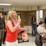 Tonya Guinn of the Trail Youth project reaches for name from the bag of raffle entrants. (Evan Pappas/Staff Photo)