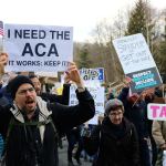 Many of the signs carried by marchers advocated for the Affordable Care Act. Nicole Jennings/staff photo