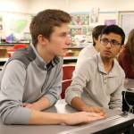 Shyam Ghandi looks over to Noah Vaughn to begin discussing a practice question. (Evan Pappas/Staff Photo)