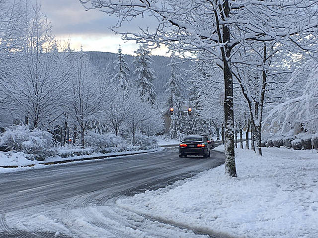 Photo courtesy of the city of Snoqualmie                                City streets on Snoqualmie Ridge were clogged with snow last Monday after an unexpectedly heavy snowfall began to stick to roads. The city closed Snoqualmie Parkway for several hours during the evening.