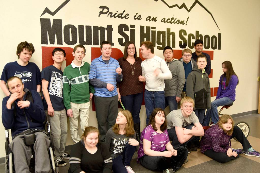 Katelyn Walker, center, poses for a photo with some of her Life Skills students. Carol Ladwig/Staff Photo